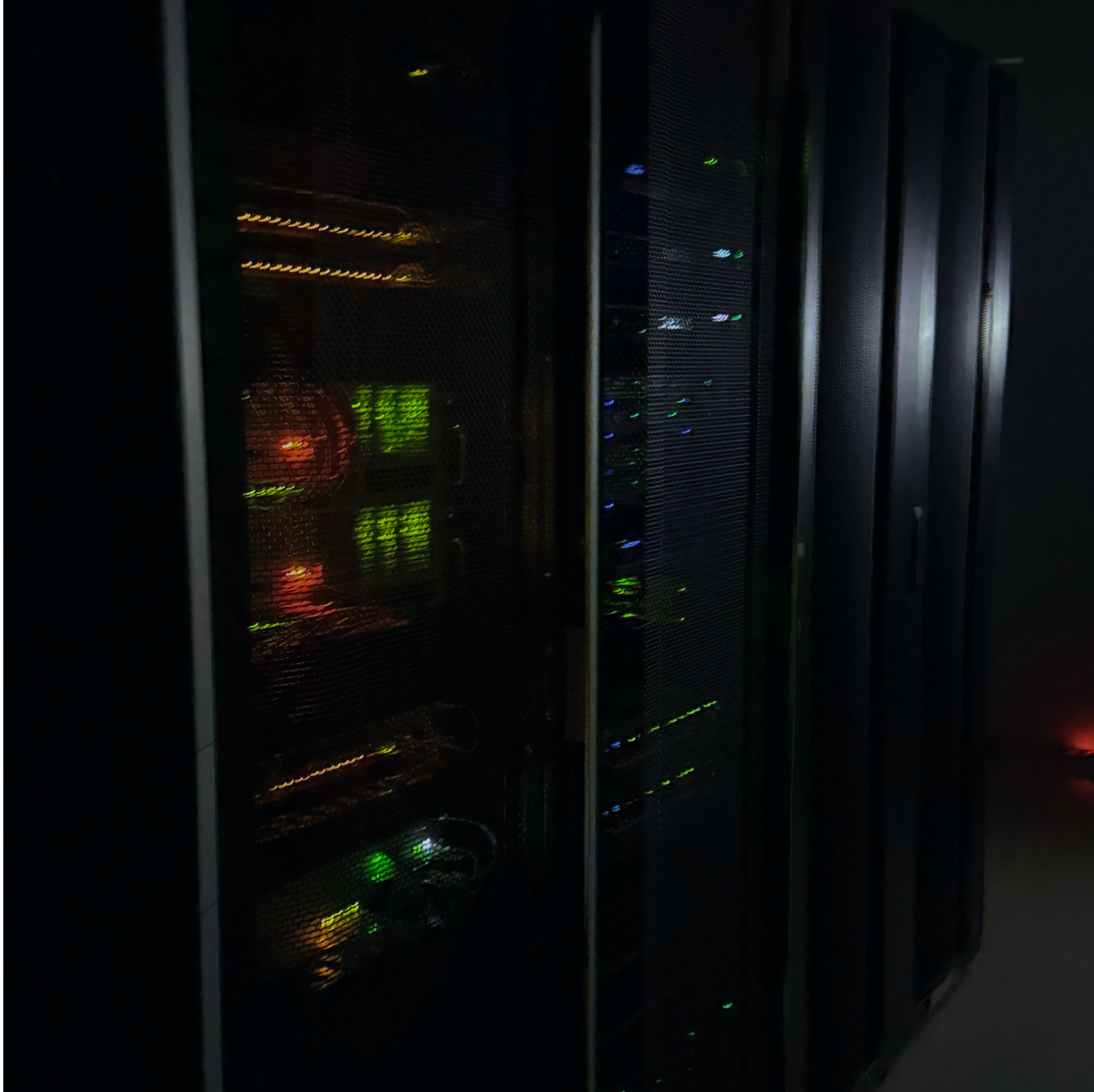 Modern data center server room with advanced rack-mounted equipment, organized cable management, and LED indicators showing operational status